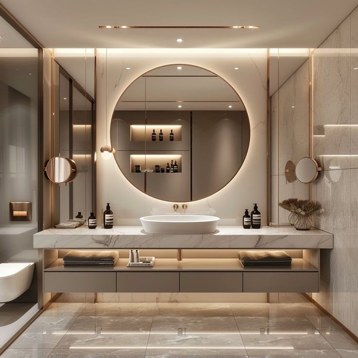 a bathroom with a large round mirror above the sink