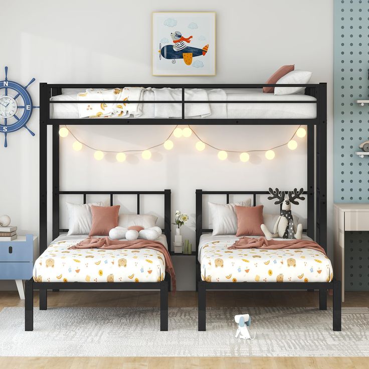 two twin beds in a bedroom with string lights on the headboard and foot board