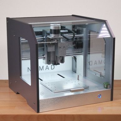 a 3d printer is shown on a wooden table