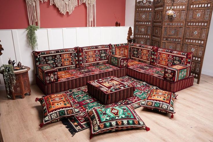 a living room filled with lots of colorful rugs