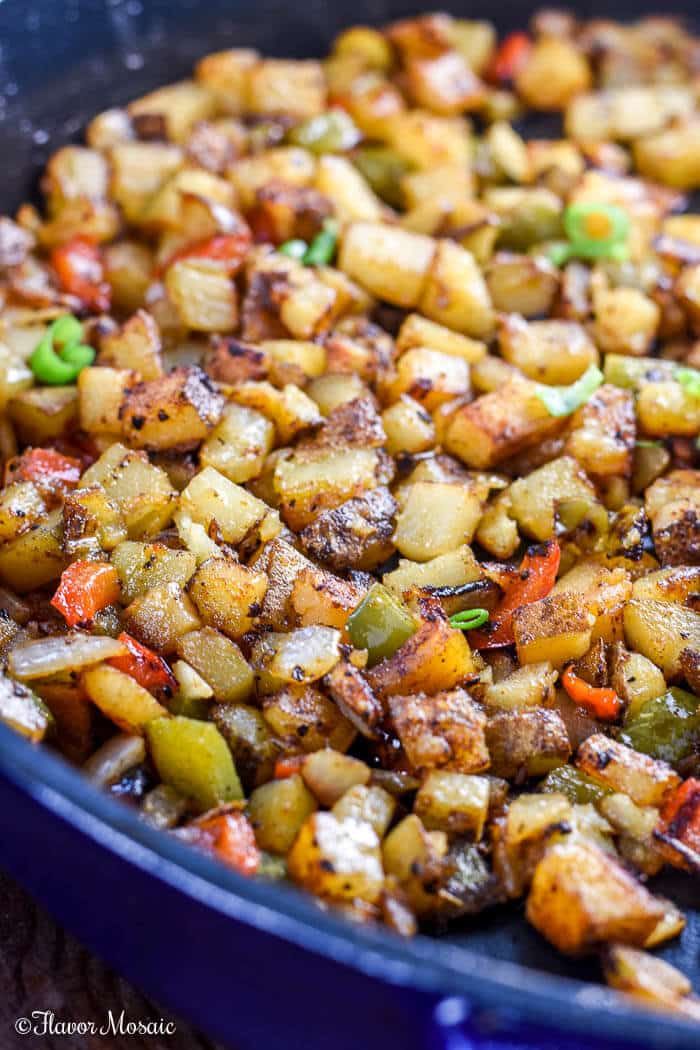 a pan filled with cooked potatoes and vegetables