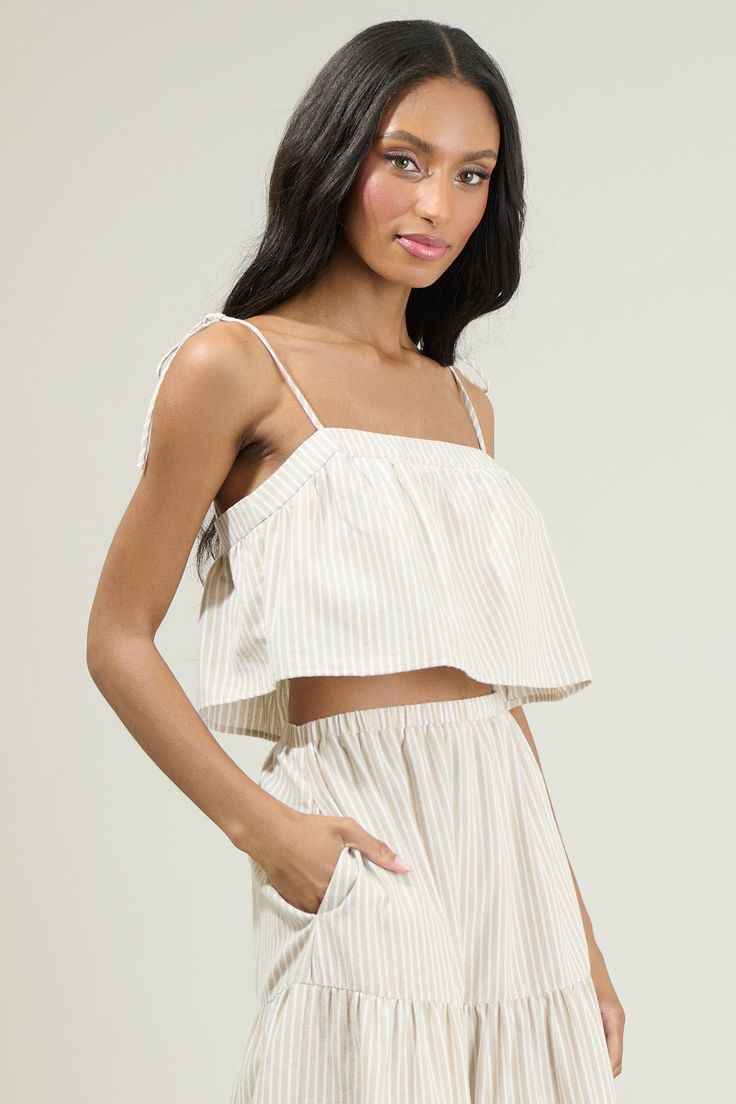 Better grab your favorite shades, 'cause the Everlanes Striped Crop Top is here to welcome in those bright sunny days! A summery striped pattern throughout, shapes self-tie spaghetti straps that support a cropped look! Wear it with the matching skirt to complete a summer look! - Stripe- Tie strap- Crop top- Lined- Color: Tan WhiteSize + Fit - Model is 5'8" and wearing size XS- Measurements taken from size S - Chest: 17 1/4"- Length: 10" Fabric Self: 50% Polyester 50% Cotton Lining: 97% Polyester Strap Crop Top, Striped Crop Top, Striped Tie, Summer Look, Crop Tank, Summer Looks, Blue Stripes, Sunny Days, Spaghetti Strap