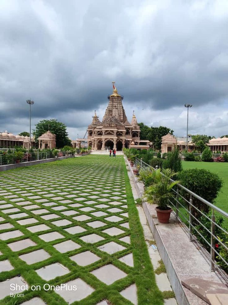 a large building sitting on top of a lush green field