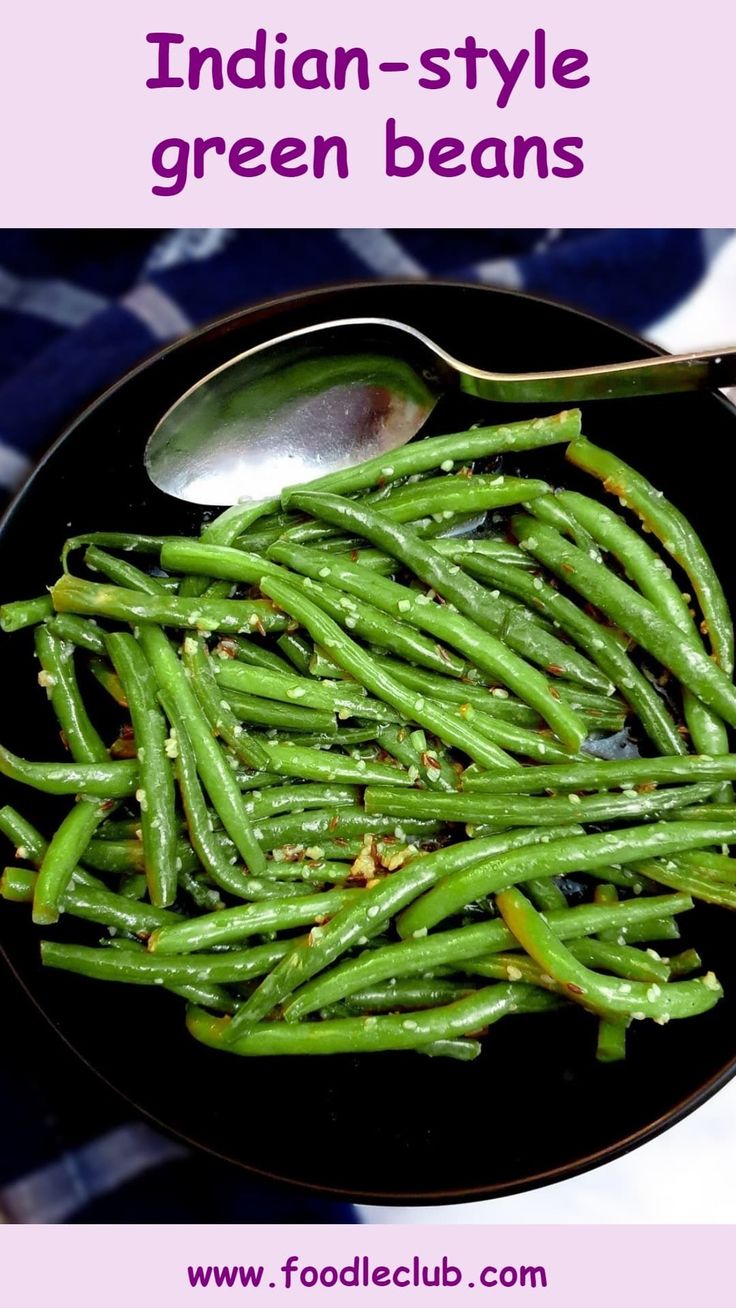 Indian-style green beans in a black serving dish with a large serving spoon. Green Beans Indian Recipe, Green Beans Vegan Recipe, Curry Green Beans Recipe, Green Bean Indian Recipes, Indian Style Green Beans, Indian Beans, Green Beans Healthy Recipe, Indian Green Beans Recipe, Curry Green Beans