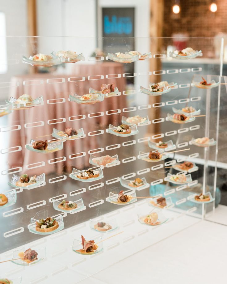 a display case filled with lots of small desserts