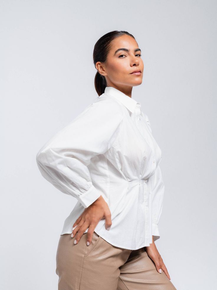 White contoured button up blouse. Balloon sleeves. Sizes: S,M 100% Cotton Fitted Padded Button-up Blouse, Formal Puff Sleeve Top With Button Closure, White Office Tops With Button Cuffs, White Tops With Button Cuffs For Office Wear, Padded Button-up Blouse For Office, Padded Button-up Blouse For Work, Padded Button-up Blouse For Fall, Fall Padded Button-up Blouse, Fitted Button-up Shirt With Padded Blouse