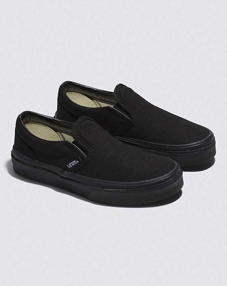 Kids Slip-On Shoe Vans Slip-ons With Rubber Sole For Streetwear, Black Sporty Slip-ons With Rubber Sole, Casual Black Slip-resistant Slip-ons, Classic Black Sneakers With Rubber Toe Cap, Classic Slip-ons With Vulcanized Sole For Streetwear, Urban Black Slip-on Skate Shoes, Black Slip-resistant Skate Shoes, Black Low-top Slip-ons With Rubber Sole, Black Skate Shoes With Rubber Heel Cap