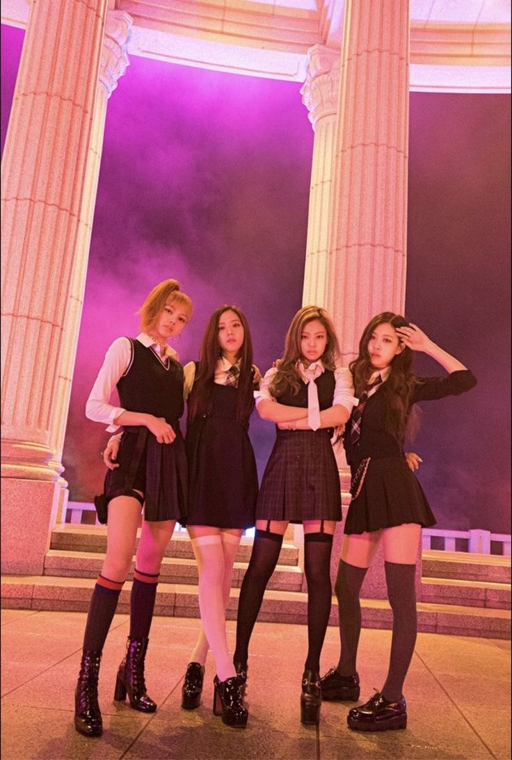 three girls in school uniforms posing for the camera with their hands on their hipss