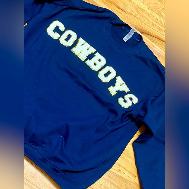 Beautiful Blue Cowboy Football Sweatshirt Blue Screen Print Sweatshirt For Streetwear, Blue T-shirt For Fall Streetwear, Pre-shrunk Blue Crew T-shirt, Varsity Blue T-shirt With Text Print, Blue Varsity T-shirt With Text Print, Blue School Spirit T-shirt With Text Print, Blue Relaxed Fit Pre-shrunk Sweatshirt, Relaxed Fit Blue Pre-shrunk Sweatshirt, Blue Fan Apparel Sweatshirt For Fall