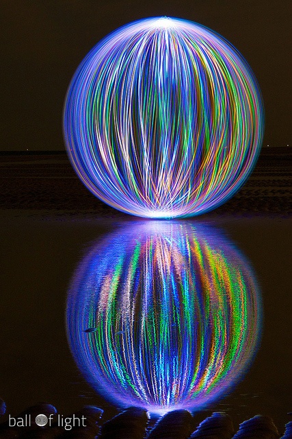 a ball of light is reflected in the water