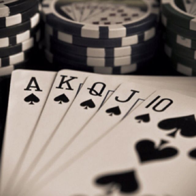 playing cards and poker chips on a table