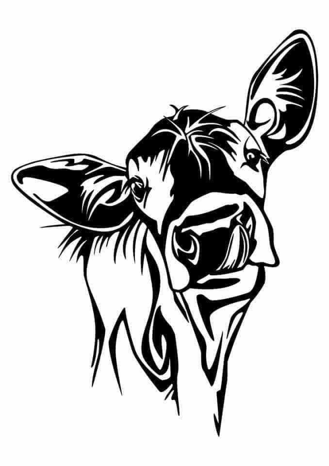 a black and white cow's head is shown in the shape of a tattoo