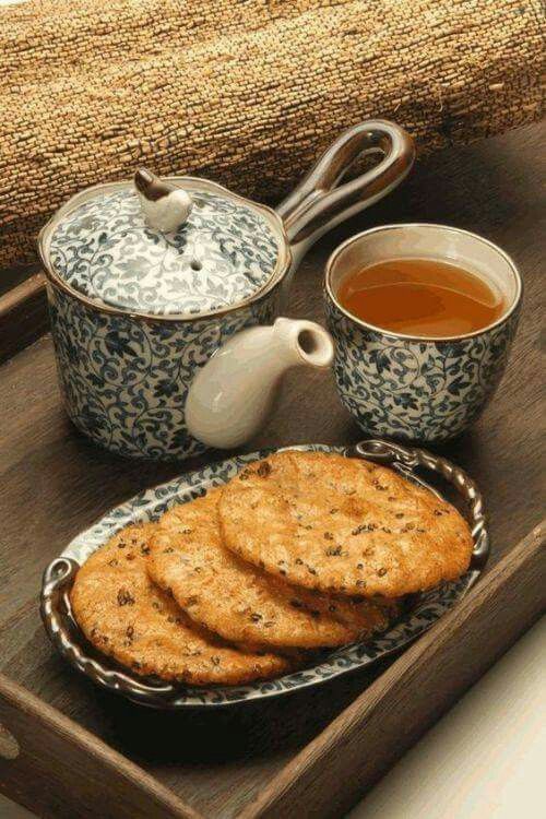 a tray with crackers and tea on it