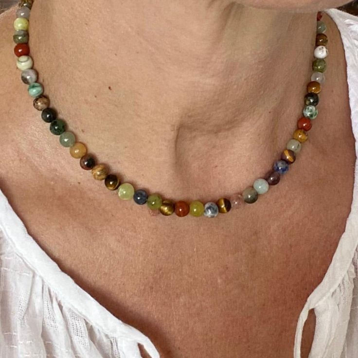 Gemstone mix "rainbow" necklace is pretty to be worn alone or as part of layering. If you like to attach a pendant this pretty necklace easily becomes a statement piece. Use extender chain to wear the necklace longer. Length 15" The healing powers and positive energy of precious and semi precious stones are known in the Crystal world since ancient times and some gems are recognized to be real power stones which can help with grounding, protection of aura and energy field, balance and can provide Rainbow Natural Stones Round Beads Necklaces, Rainbow Gemstone Beads Round Necklace, Rainbow Gemstone Beads Necklace, Rainbow Round Beads Necklace For Healing, Rainbow Single Strand Spiritual Necklace, Multicolor Single Strand Crystal Necklace For Healing, Multicolor Single Strand Jewelry For Healing, Rainbow Single Strand Round Necklace, Rainbow Round Single Strand Necklace