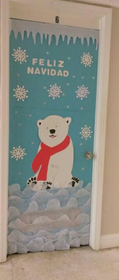 a door decorated with an image of a polar bear wearing a scarf and holding a red scarf