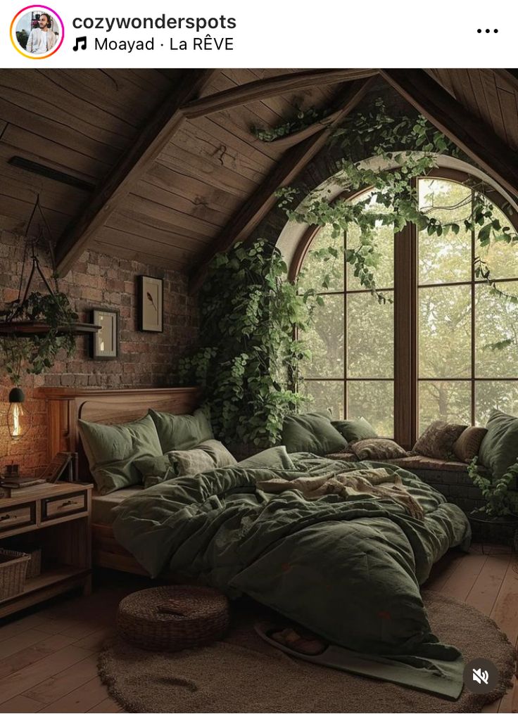 a bedroom with an arched window and green comforter