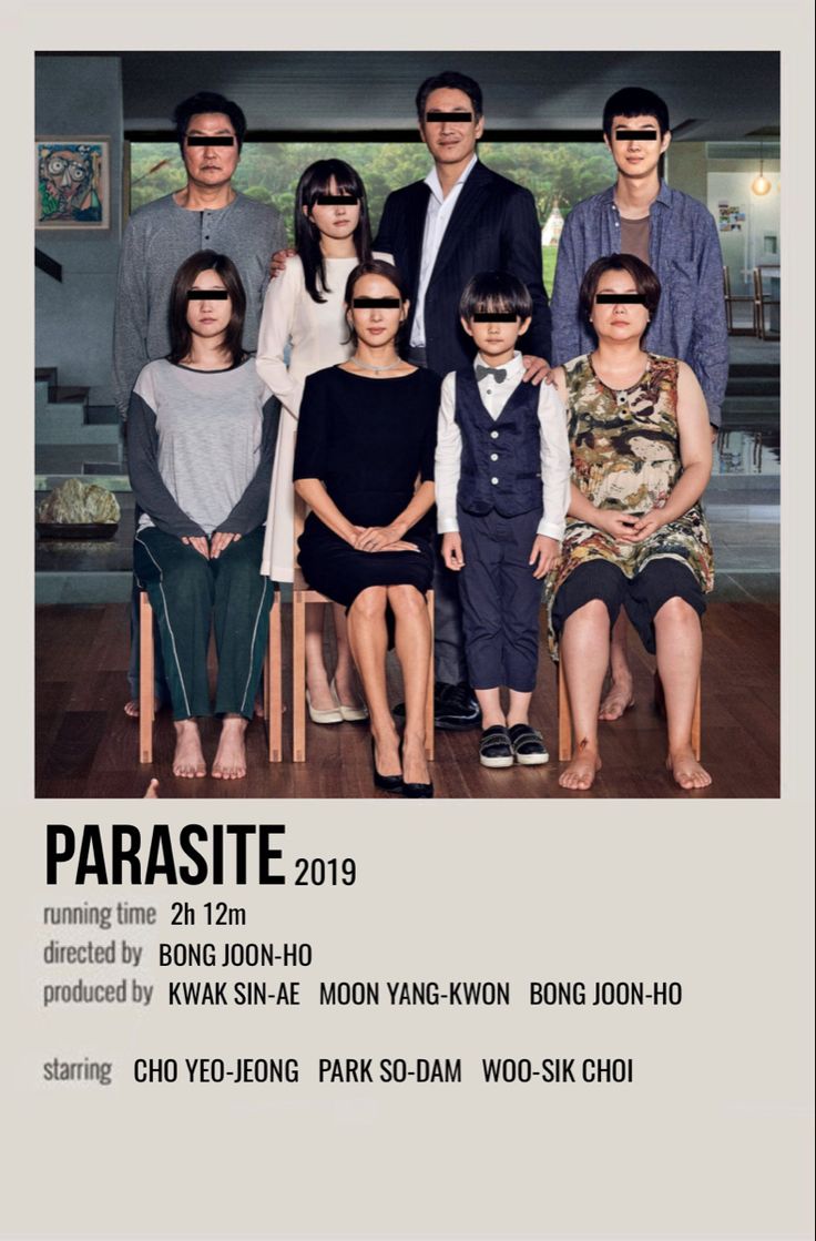 a group of people sitting next to each other in front of a poster with the words parasite