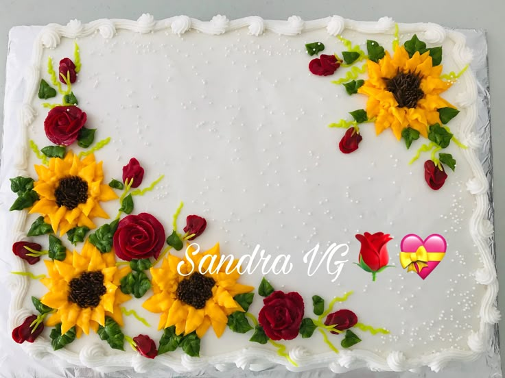 a cake decorated with sunflowers and roses