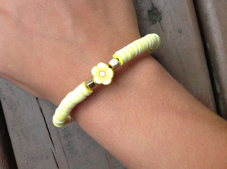 This is a yellow flower bracelet! Cheap Yellow Flower Bracelet, Trendy Yellow Flower-shaped Jewelry, Trendy Yellow Flower Shaped Jewelry, Elegant Yellow Flower-shaped Jewelry With Flower Decoration, Yellow Flower-shaped Jewelry With Flower Decoration, Yellow Flower-shaped Jewelry For Spring, Spring Yellow Flower-shaped Jewelry, Yellow Jewelry With Flower Decoration For Spring, Yellow Spring Jewelry With Flower Decoration