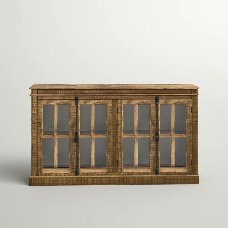 an old wooden cabinet with glass doors on the front and side, against a white background