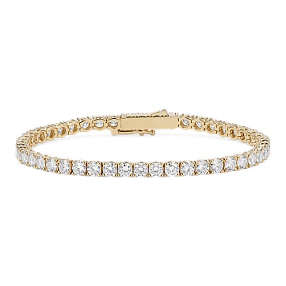 This stunning lab-grown diamond tennis bracelet offers beautiful sparkle  whether worn alone or stacked with other favorite bracelets. The diamonds are hand-matched for consistent beauty while the box clasp features a figure-eight safety latch for extra security. Crafted in warm 14-karat yellow gold  it makes a special gift or a classic addition to your own jewelry collection. Diamond Tennis Bracelet Gold, Luxury Bracelet Stack, Luxury Bracelet, Diamond Tennis Bracelet, Box Clasp, Tennis Bracelet Diamond, Luxury Resort, Tennis Bracelet, Bracelet Stack