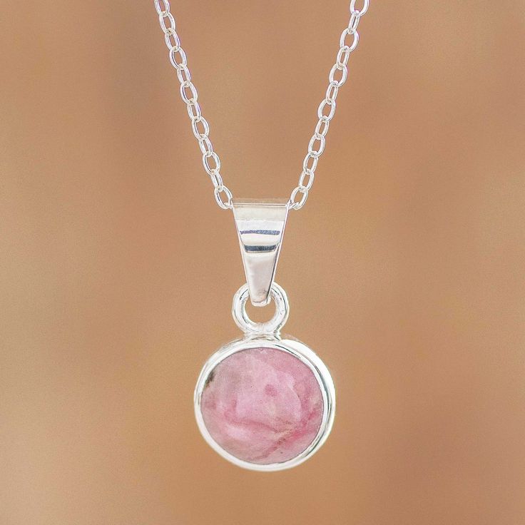 This dainty pendant necklace is designed and crafted by Carolina Quiroa. Set in polished sterling silver rosy rhodonite is naturally lovely. Silver Jewelry With Natural Stones And Rhodonite, Pink Sterling Silver Round Pendant Necklace, Pink Sterling Silver Oval Pendant Jewelry, Round Rhodonite Jewelry With Natural Stones, Rhodonite Necklace, Dainty Pendant Necklace, Dainty Pendant, Ring Fit, Jewelry Packaging