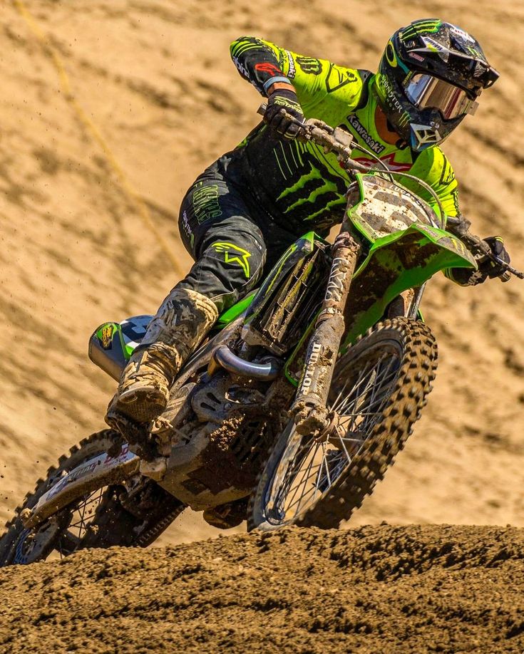 a man riding on the back of a dirt bike