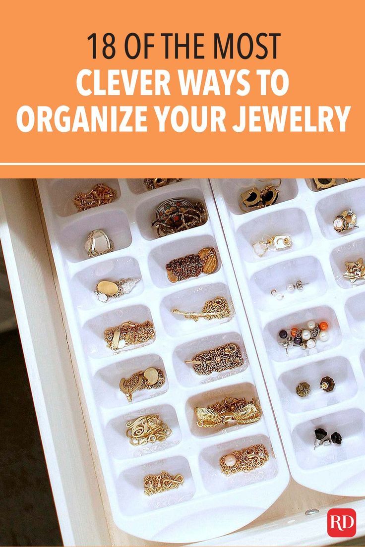 an open jewelry box filled with lots of different types of rings and bracelets on it