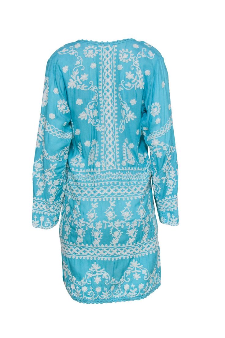 Go bright and bohemian with this funky frock from Melissa Odabash! Made in a vibrant sky blue hue with chic embroidery throughout, this easy and breezy beauty is perfect for throwing on after a day at the beach! Pair with strappy sandals and a straw bag and you'll be all set for dinner by the sea or a stroll on the boardwalk. Size S 100% Rayon Pullover Unlined Shift silhouette V-neckline Long sleeve All-over embroidered design Lace trim on neckline and hem Bust 40" Waist 37" Sleeve length 21" Sh Blue V-neck Dress With Resham Embroidery, Turquoise Dresses With Resham Embroidery, Light Blue Chikankari Embroidery Dress, Light Blue Embroidered Summer Dress, Light Blue Embroidered Beach Dress, Casual Blue Embroidered Dress For Vacation, Blue Embroidered Dress With Resham Embroidery For Spring, Long Sleeve Embroidered Summer Beach Dress, Light Blue Long Sleeve Dress With Floral Embroidery