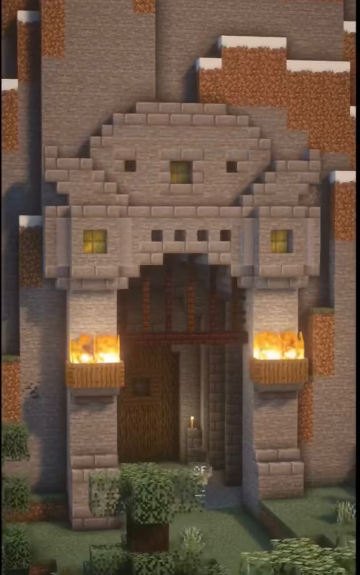 an image of a house made out of blocks and bricks with fire coming from the windows