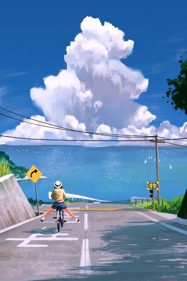 a man riding a bike down a street next to a tall cloud in the sky