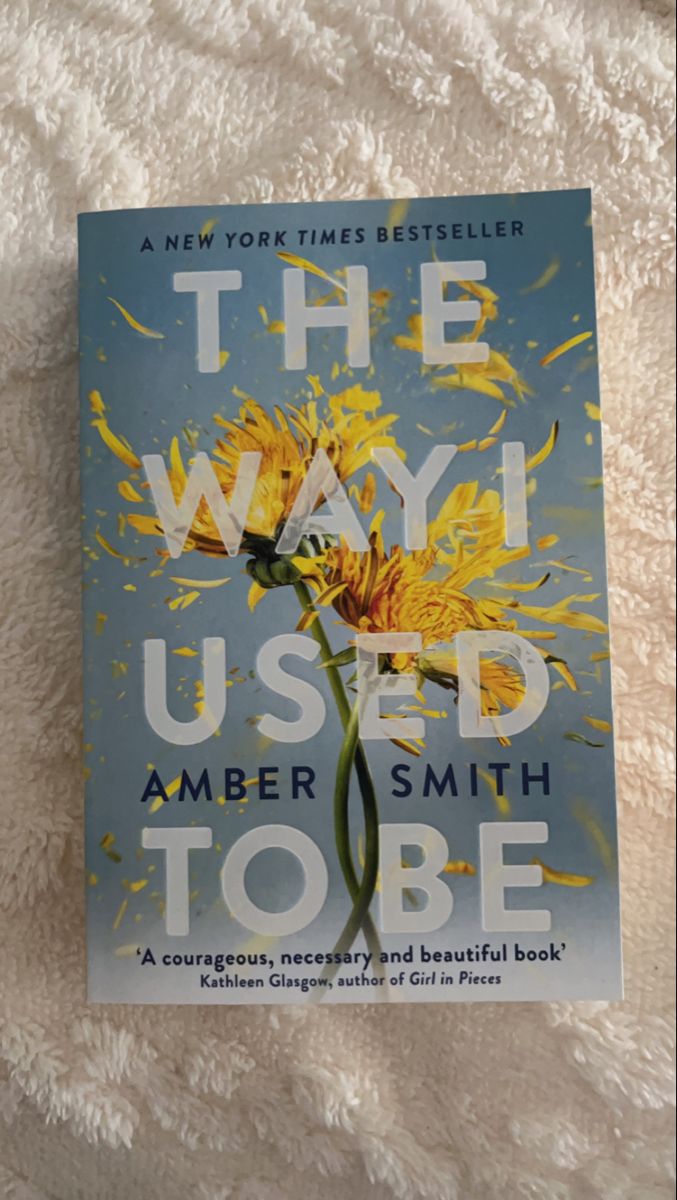 the way i used to be by amber smith toee on a white bed sheet