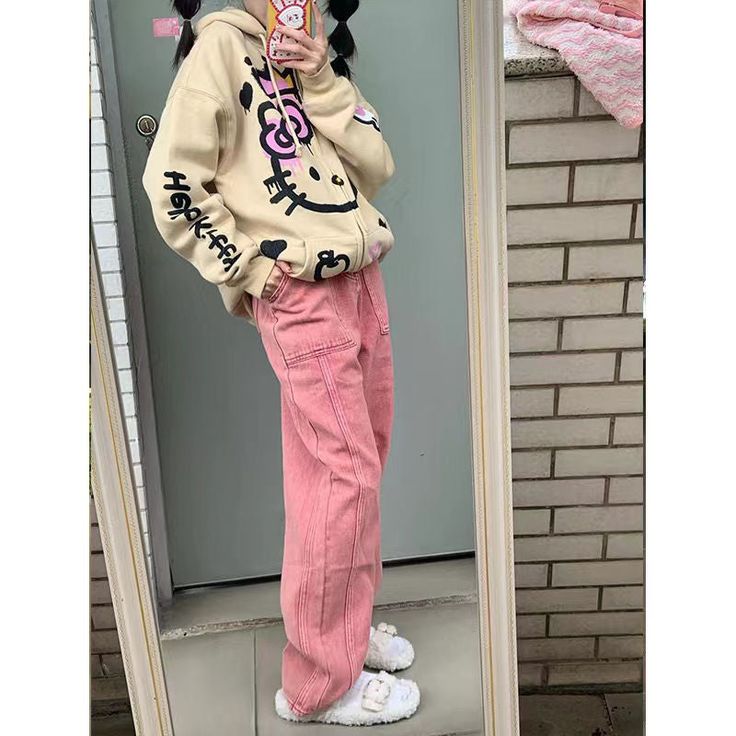 This hoodie features a the iconic Hello Kitty print and perfect for everyday wear. Casual Pink Hoodie With Cartoon Print, Trendy Long Sleeve Hoodie With Hello Kitty Print, Cute Oversized Cotton Hoodie, Oversized Cute Cotton Hoodie, Hooded Cat Print Sweatshirt For Streetwear, Hooded Sweatshirt With Cat Print For Streetwear, Cotton Hoodie With Cartoon Print For Spring, Casual Long Sleeve Hoodie With Cat Print, Long Sleeve Cotton Hoodie With Cat Print