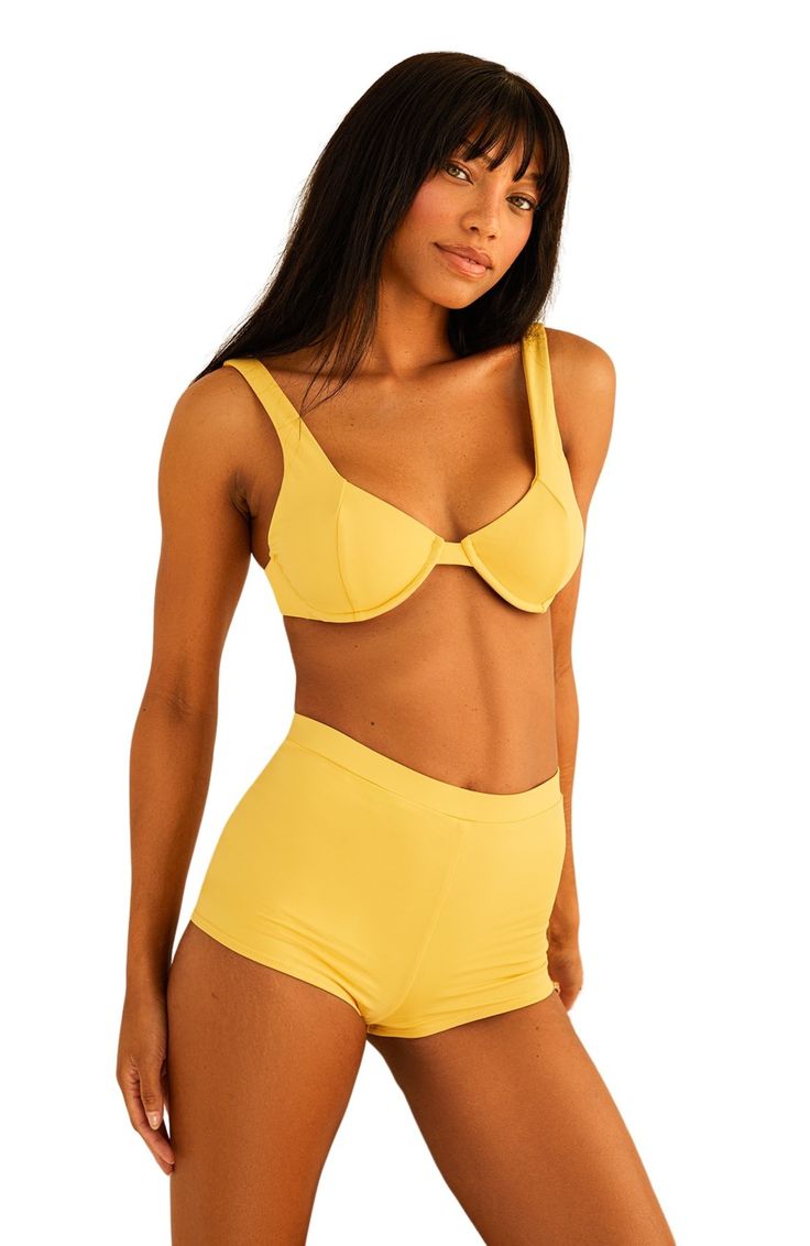 Be beach ready in our Faye Top! This underwire bikini top provides an uplifting fit, giving you a flattering silhouette and enough support for any activity. 80% Nylon 20% Spandex Imported from Vietnam Underwire Adjustable wide straps, tie back Sporty Nylon Swimwear With Removable Bra Pads, Underwire Swimwear With Medium Bust Support, Padded Push-up Swimwear, Summer Nylon Bra, Summer Beach Swimwear With Medium Bust Support, Beach Swimwear With Medium Bust Support, Summer Padded Underwire Swimwear, Beachwear Swimwear With Medium Bust Support, Summer Swimming Bra With Removable Pads