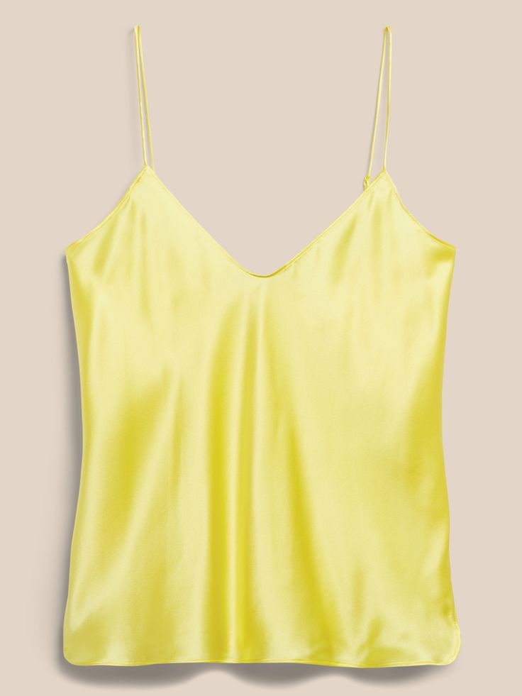 An indulgent, elegant essential, this versatile camisole is crafted from our washable silk charmeuse and cut on the bias for figure-flattering drape.  SEMI-FITTED: Cut for a not-too-tight, not-too-loose fit.  V-neck.  Adjustable slider straps.  Dolph Silk Cami Tank Top With Built-in Bra, Sleek Silk V-neck Camisole, V-neck Satin Camisole With Delicate Straps, Chic Solid Camisole Slip Dress, Chic Camisole Slip Dress, Silk Camisole With Built-in Bra, Silk Cami Top With Built-in Bra, Summer Silk Tank Top With Built-in Bra, Silk Camisole With Built-in Bra And Spaghetti Straps