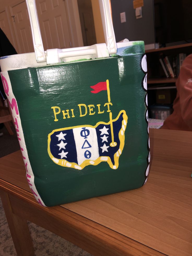 a bag that is sitting on top of a table in front of a book shelf