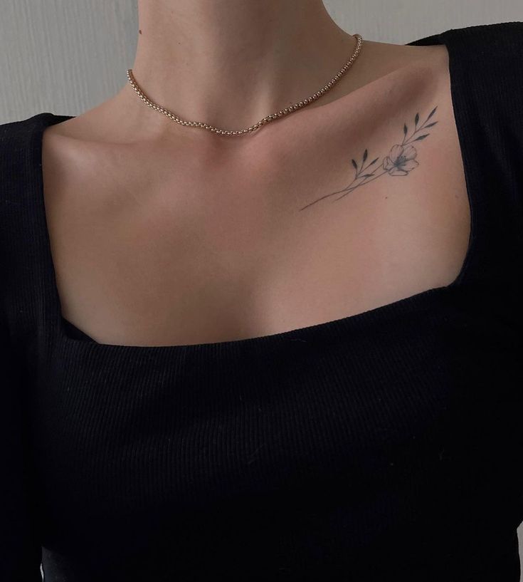 a woman with a tattoo on her chest