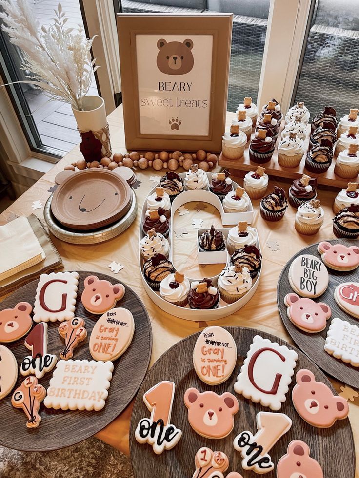 several decorated cookies and pastries are on the table