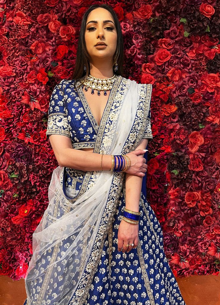 Subtle hues of whimsy blend with floral embroideries in this Royal Blue lehenga. The mehreen lehenga, embroidered with beautiful floral motifs and golden embroidery work, looks every bit of the royal self! Color - Fabric & Work Style -- Silk lehenga: Rich embroidery, floral embroidery work.- Silk embroidered blouse.- Net dupatta. Details -- Assured quality.- Wash care instruction: Dry clean only.- Slight variation in color is possible due to digital photography. Floor-length Lehenga With Floral Embroidery For Festivals, Designer Anarkali Lehenga With Floral Embroidery, Traditional Drape Lehenga With Floral Embroidery For Eid, Diwali Floral Embroidered Lehenga With Traditional Drape, Diwali Floral Embroidery Lehenga With Traditional Drape, Diwali Floral Embroidered Traditional Lehenga, Festive Choli With Floral Embroidery, Designer Floral Embroidery Lehenga For Eid, Festive Choli With Floral Embroidery And Traditional Drape