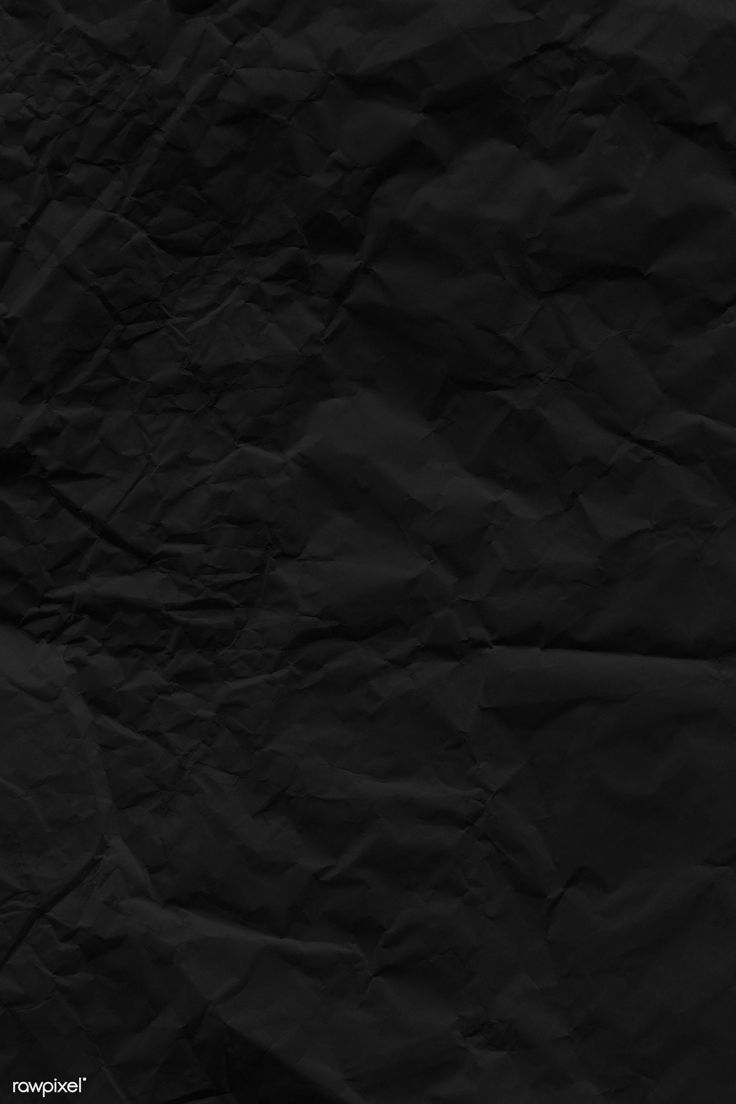 a black paper textured background that looks like it is crinkled or crumpled