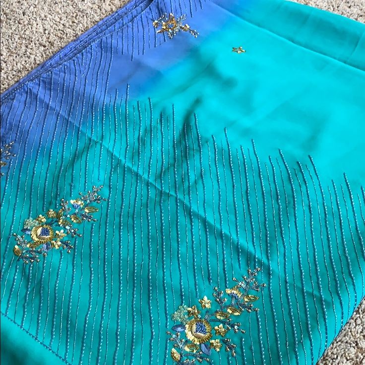 Gorgeous Ombr Colored Sari! Light Weight And Easy To Wear But Simple, Classic Embroidery. Comes With 2 Different Blouses As Well So Can Be Styled In Whichever Way You Choose. Brand New With Tags! Elegant Embellished Blue Blouse Piece, Semi-stitched Embellished Blue Blouse Piece, Blue Embellished Saree For Eid, Blue Embellished Salwar Kameez With Traditional Drape, Blue Embellished Saree For Festivals, Elegant Blue Embellished Saree, Semi-stitched Embellished Blue Saree, Blue Bollywood Blouse For Formal Occasions, Blue Bollywood Style Formal Blouse Piece