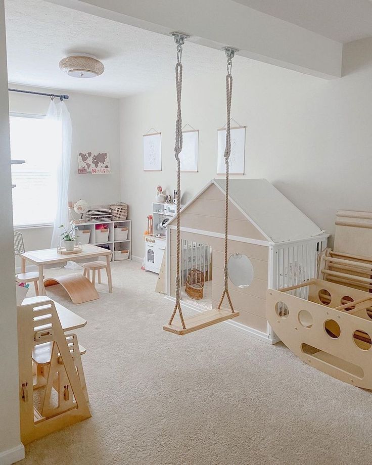 a child's playroom with toys and furniture in the room, including a doll house