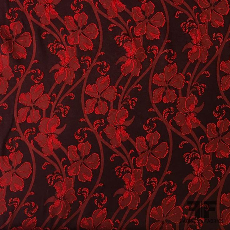 a red and black background with flowers on it