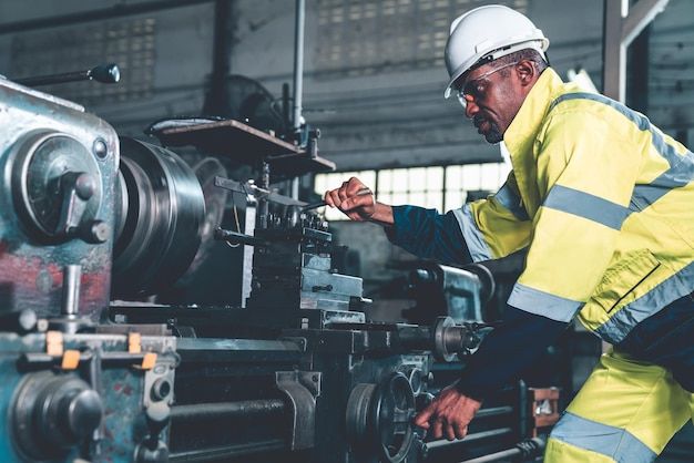 a man working on machinery in a factory