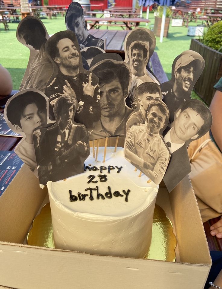 a birthday cake with pictures of people on it