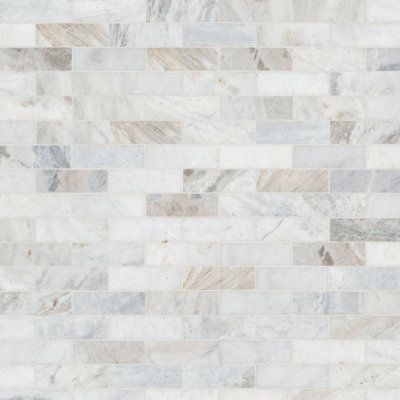 a white and grey marble tile wall