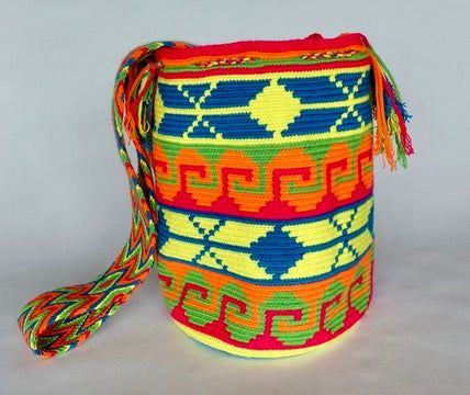 Mochila purse made by artisans of the Wayuu Indigenous Group in Colombia Purchased directly from Artisan, on a Fair Trade Basis Fully Handmade For each Wayuu Mochila Bag purchased, Hands of Colombia donates thread to Indigenous Artisans. Only ONE available Add a touch of indigenous craftsmanship to your style with our Arcoiris Wayuu Handmade Mochila Purse. Each purse is meticulously handmade by skilled artisans from the Wayuu Indigenous Group in Colombia. Hands of Colombia purchases each item in Multicolor Woven Bucket Bag As Gift, Multicolor Woven Bucket Bag Gift, Artisan Multicolor Bucket Bag For Daily Use, Traditional Multicolor Bucket Bag For Daily Use, Traditional Multicolor Bucket Bag, Bohemian Multicolor Bucket Bag Gift, Handmade Multicolor Pouch Bucket Bag, Multicolor Woven Crochet Bag Gift-ready, Multicolor Handwoven Bucket Bag As A Gift