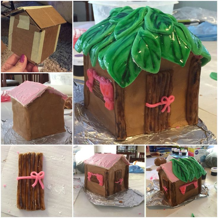 there is a gingerbread house made to look like it has pink icing on the roof