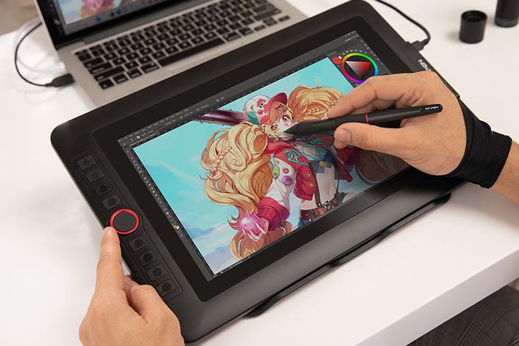 a person is drawing on an ipad