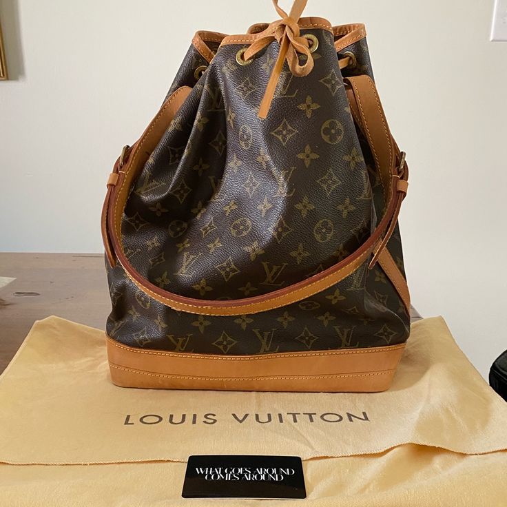 Vintage Louis Vuitton Noe Bag. This Is Vintage Bag From 1995 And Does Not Have The Tag Inside The Bag. However It Does Have Proof Of Authenticity With The Card From What Goes Around Comes Around. There Are Some Water Stains On The Bottom Of The Bag And Around The Top Edge. Nothing Super Noticeable Unless You Really Look For It. Otherwise In Great Condition. The Shoulder Strap Is Perfect. Stored In The Cloth Bag (And I Have Never Used It). Date Code Ar0925 - Last Picture. (I Had To Watch A Video Designer Brown Bag With Original Box, Designer Pre-owned Shoulder Bag, Luxury Everyday Pre-owned Shoulder Bag, Luxury Pre-owned Travel Shoulder Bag, Pre-owned Luxury Leather Shoulder Bag, Pre-owned Brown Shoulder Bag, Pre-owned Brown Monogram Canvas Bag, Luxury Pre-owned Shoulder Bag For Shopping, Pre-owned Designer Shoulder Bag